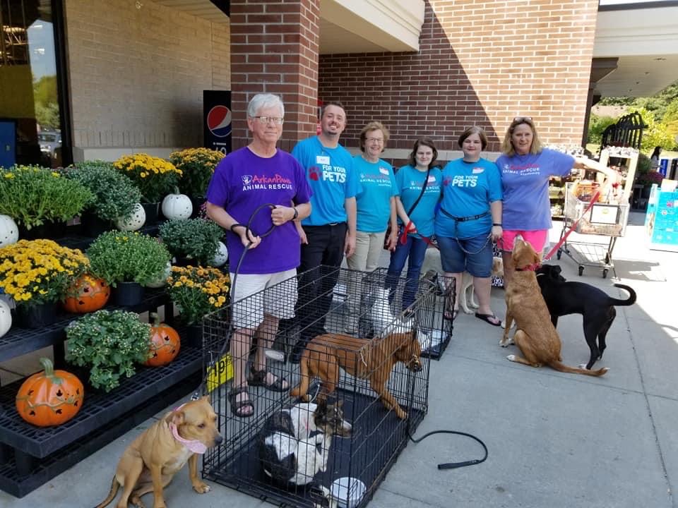 The ArkanPaws rescue volunteers and their animals